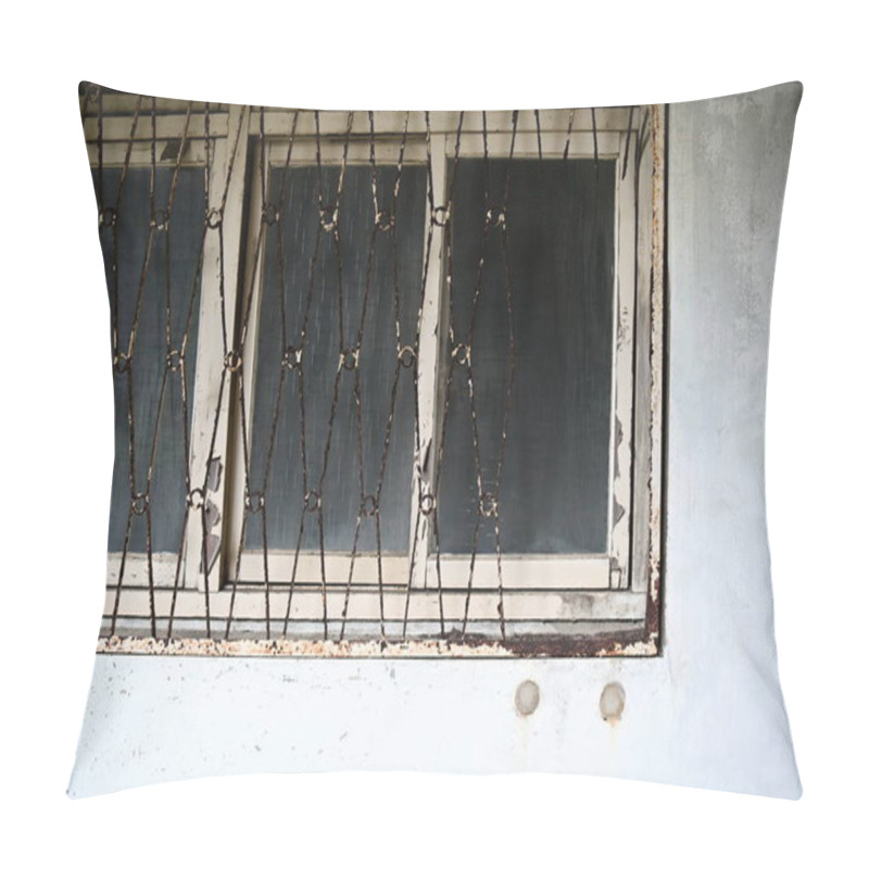 Personality  A Nostalgic Wooden-framed Window Features An Aged Iron Grille With Flaking White Paint And Rust, Embodying The Faded Charm Of A Residence Set For Redevelopment. Pillow Covers