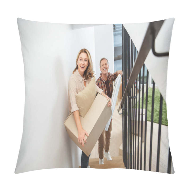 Personality  Cheerful Couple Carrying Things Upstairs And Looking At Camera Pillow Covers