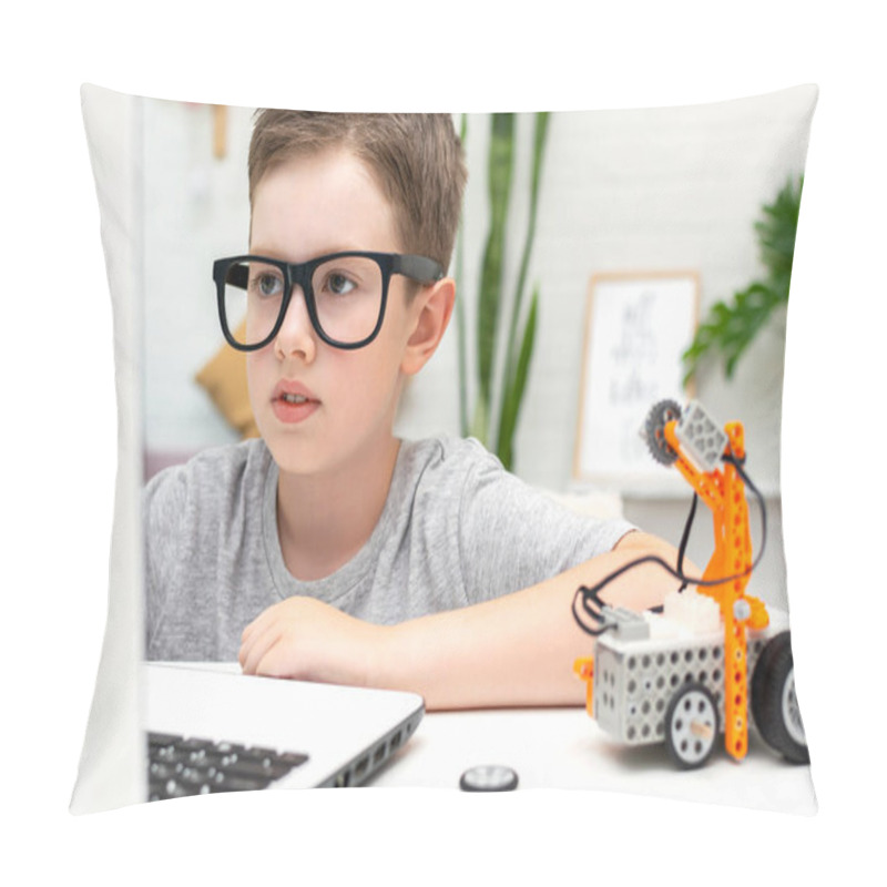 Personality  Clever Boy Builds And Programs A Robot Car Using A Laptop At Home. The Child Is Learning Coding And Programming. Robotics, Science, Mathematics, Engineering, Technology. STEM Education. Pillow Covers