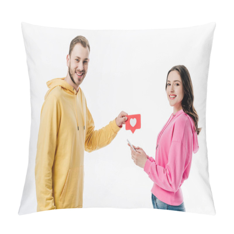 Personality  Smiling Handsome Man Giving Red Paper Cut Card With Heart Symbol To Pretty Girl Using Smartphone Isolated On White Pillow Covers