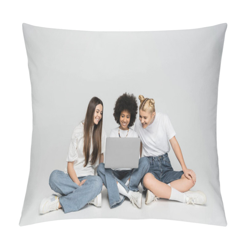 Personality  Positive Multiethnic Girlfriends In White T-shirts And Jeans Using Laptop Together While Sitting On Grey Background, Teenagers Bonding Over Common Interest, Friendship And Companionship Pillow Covers