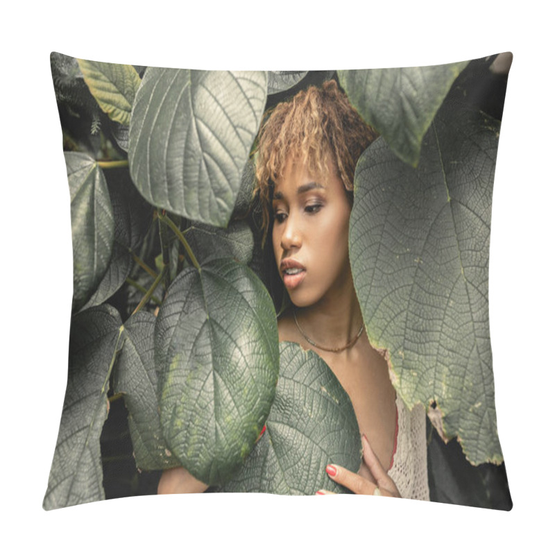 Personality  Young And Modern African American Woman With Makeup Touching And Looking At Green Foliage While Standing In Greenhouse, Stylish Woman Enjoying Lush Tropical Surroundings Pillow Covers