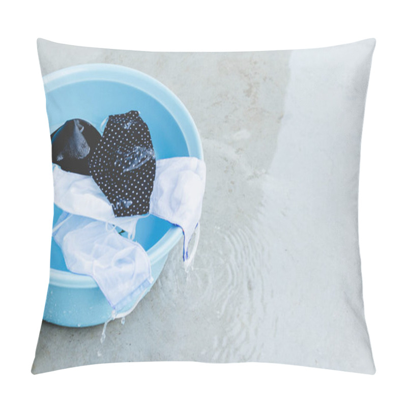 Personality  Fabric Masks Are Soaked In Blue Plastic Basin That Water Is Overflowing Ready For Washing And Rinse, Clean And Reuse To Prevent The Infection Of Covid-19. Concept Of Make Living In New Normal. Pillow Covers