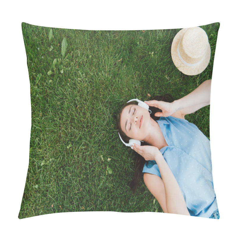 Personality  Top View Of Pretty Woman With Closed Eyes Lying On Grass And Listening Music Near Straw Hat Pillow Covers