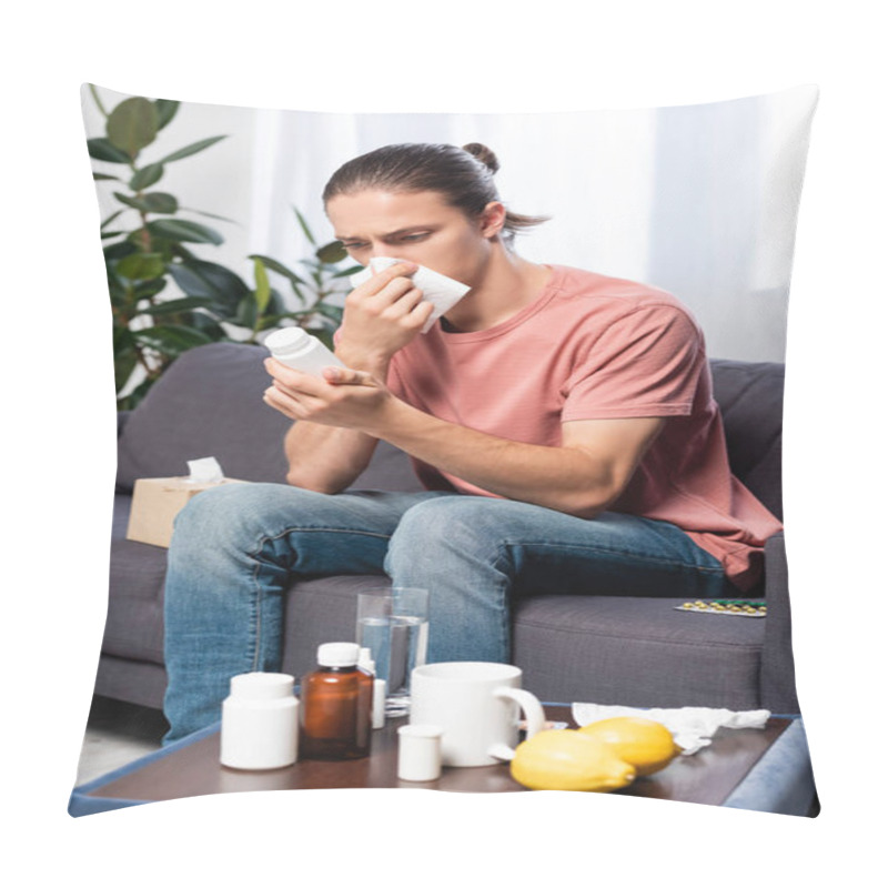 Personality  Diseased Man Wiping Nose With Paper Napkin While Sitting On Sofa And Holding Bottle With Pills Pillow Covers