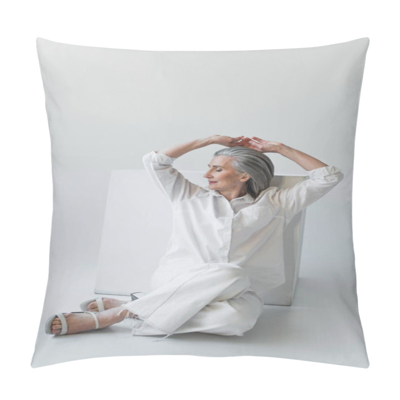 Personality  Grey Haired Woman Posing Near White Cube On Grey Background  Pillow Covers