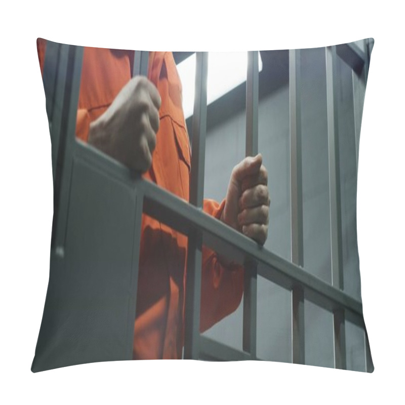 Personality  Close Up Of Prisoner In Orange Uniform Holding Metal Bars, Standing In Prison Cell. Guilty Criminal Or Killer Serves Imprisonment Term For Crime. Inmate In Jail Or Detention Center. Justice System. Pillow Covers