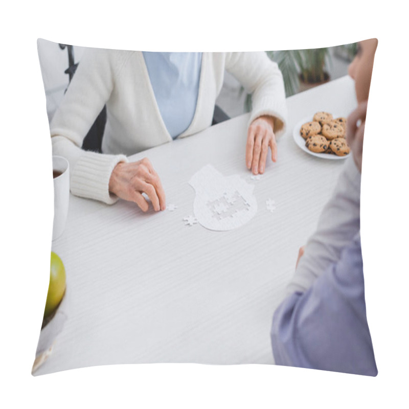 Personality  Cropped View Of Elderly Woman And Nurse Playing Jigsaw Puzzle At Home Pillow Covers