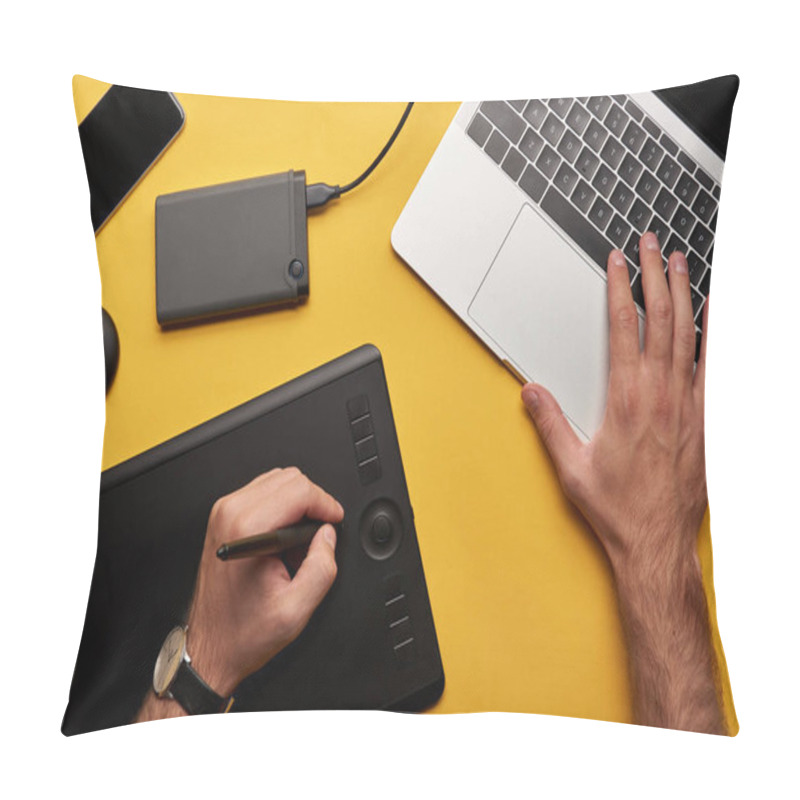 Personality  Cropped Shot Of Graphics Designer Working With Laptop And Graphics Tablet On Yellow Surface Pillow Covers