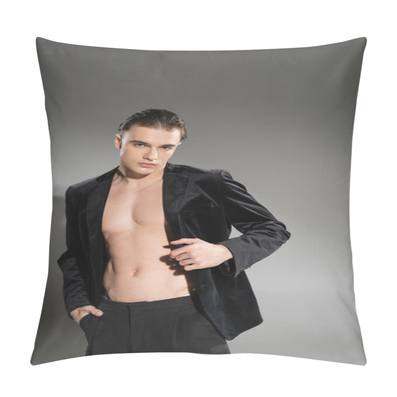 Personality  Young And Expressive Man With Brunette Hair, Wearing Stylish Silk Blazer On Shirtless Muscular Body, Posing With Hand In Pocket Of Black Pants, Looking At Camera On Grey Background Pillow Covers