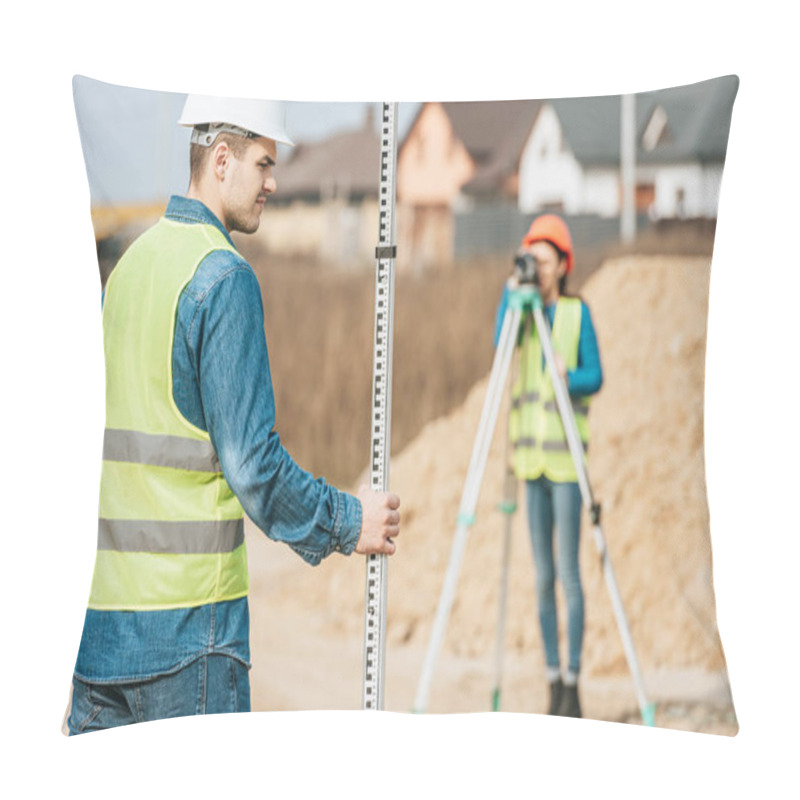 Personality  Selective Focus Of Surveyor With Ruler And Colleague With Digital Level On Background Pillow Covers