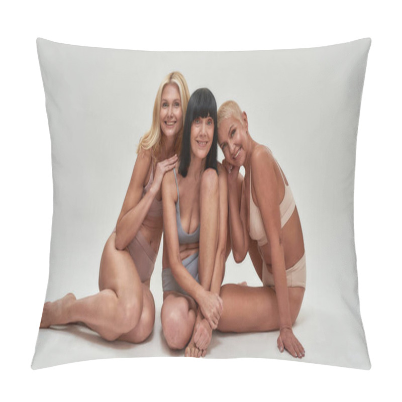 Personality  Three Caucasian Senior Women In Underwear Smiling At Camera While Posing Half Naked In Studio, Sitting Together Isolated Over Light Background Pillow Covers