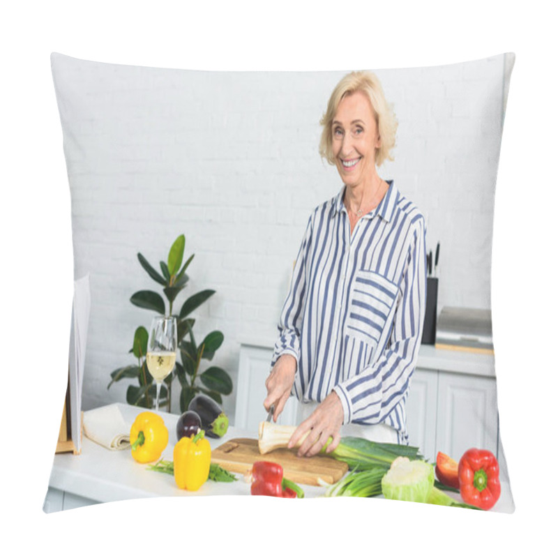 Personality  Smiling Grey Hair Woman Cutting Leek On Wooden Board In Kitchen And Looking At Camera Pillow Covers