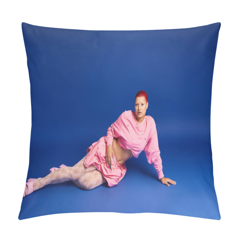 Personality  A Young Woman In A Pink Outfit Lounges Confidently Against A Striking Blue Background, Embodying Bold Fashion. Pillow Covers