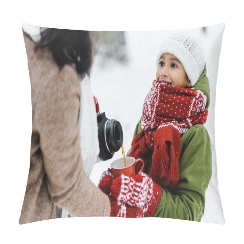 Personality  Cropped View Of Mother Giving Tea To Cute African American Smiling Daughter In Snowy Forest Pillow Covers