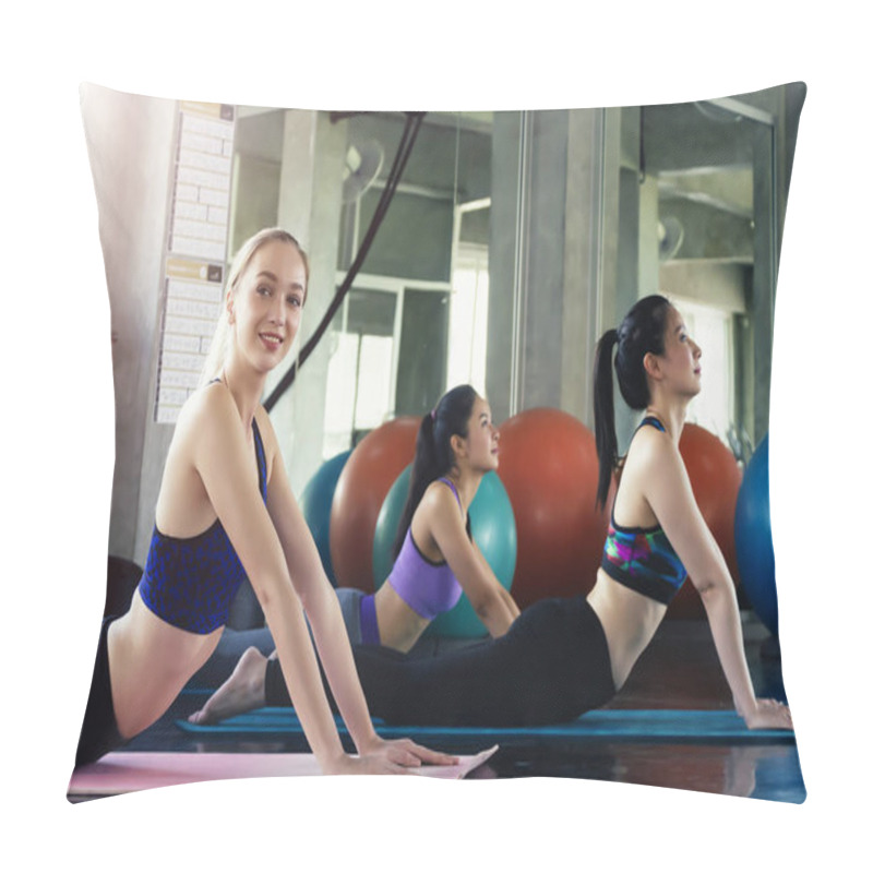 Personality  Group Of Young Sporty Attractive People Practicing Yoga Lesson,Women Practicing The Relaxing During Their Yoga Class In A Gym. Pillow Covers