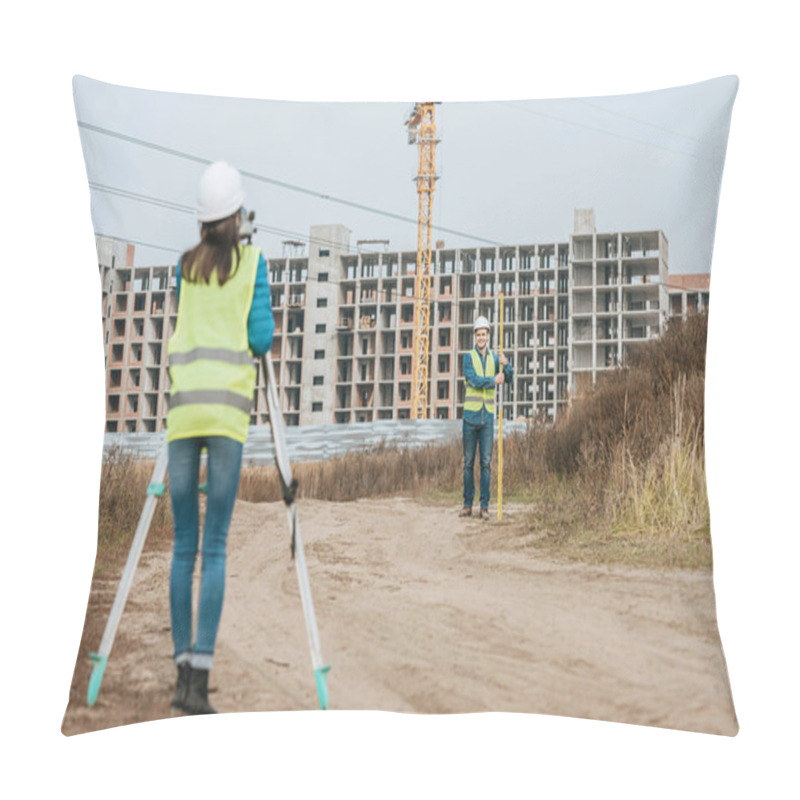 Personality  Surveyors Measuring Land On Dirt Road With Construction Site At Background Pillow Covers