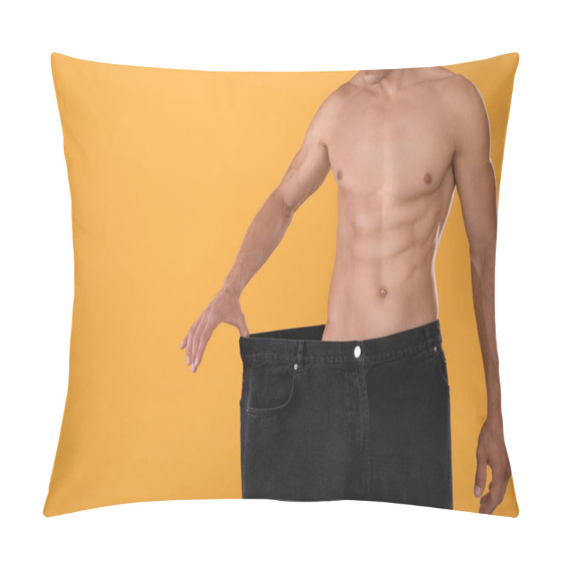 Personality  Shirtless Man With Slim Body Wearing Big Jeans On Yellow Background, Closeup. Space For Text Pillow Covers