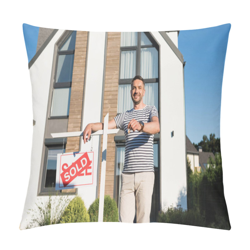 Personality  Happy Man With Key Looking At Camera While Leaning On Sign With Sold Lettering With Modern Building On Background Pillow Covers