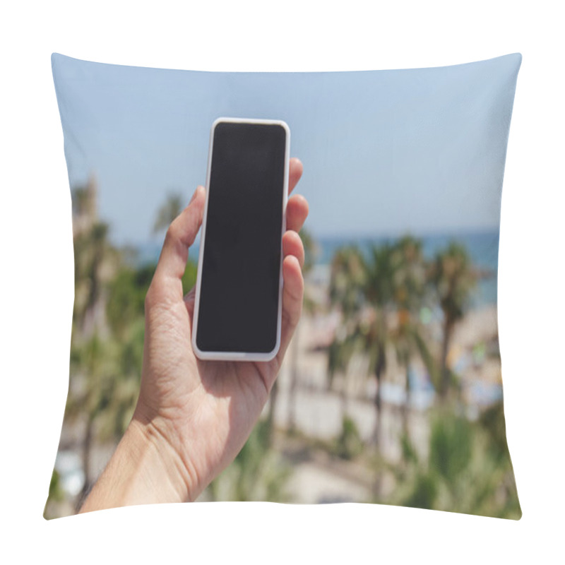 Personality  Cropped View Of Man Holding Smartphone With Palm Trees And Sea Coast At Background Pillow Covers