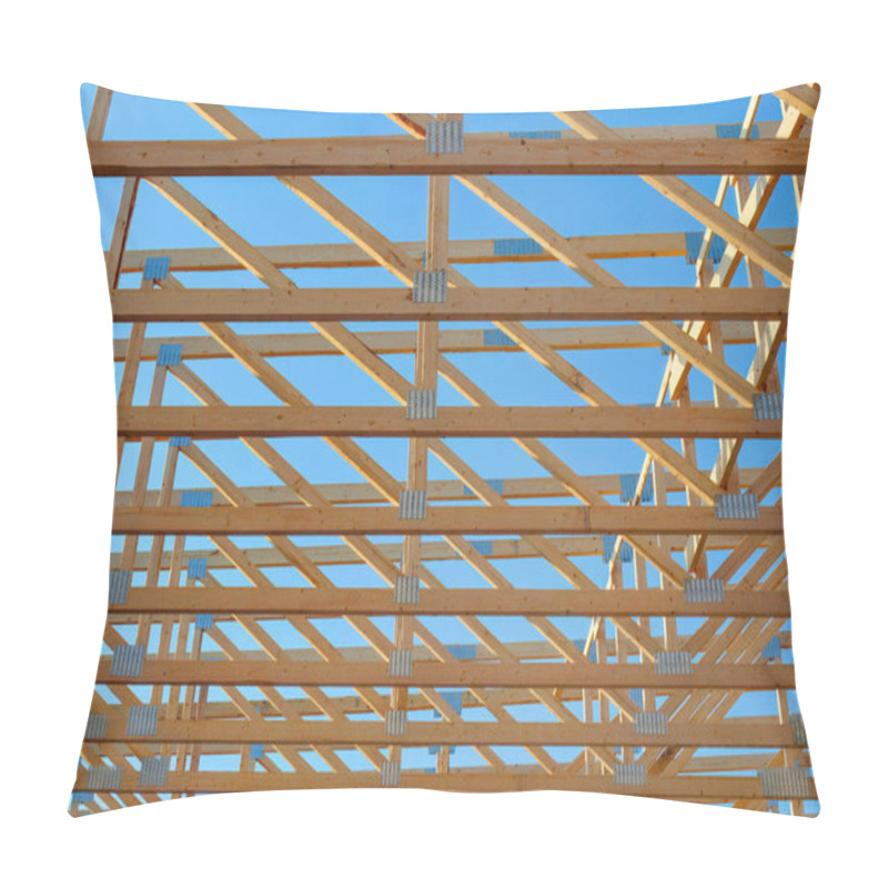 Personality  Close-up Of Wooden Roof Trusses With Metal Brackets In A House Under Construction, Showcasing Structural Framework And Carpentry Against A Clear Blue Sky. Pillow Covers