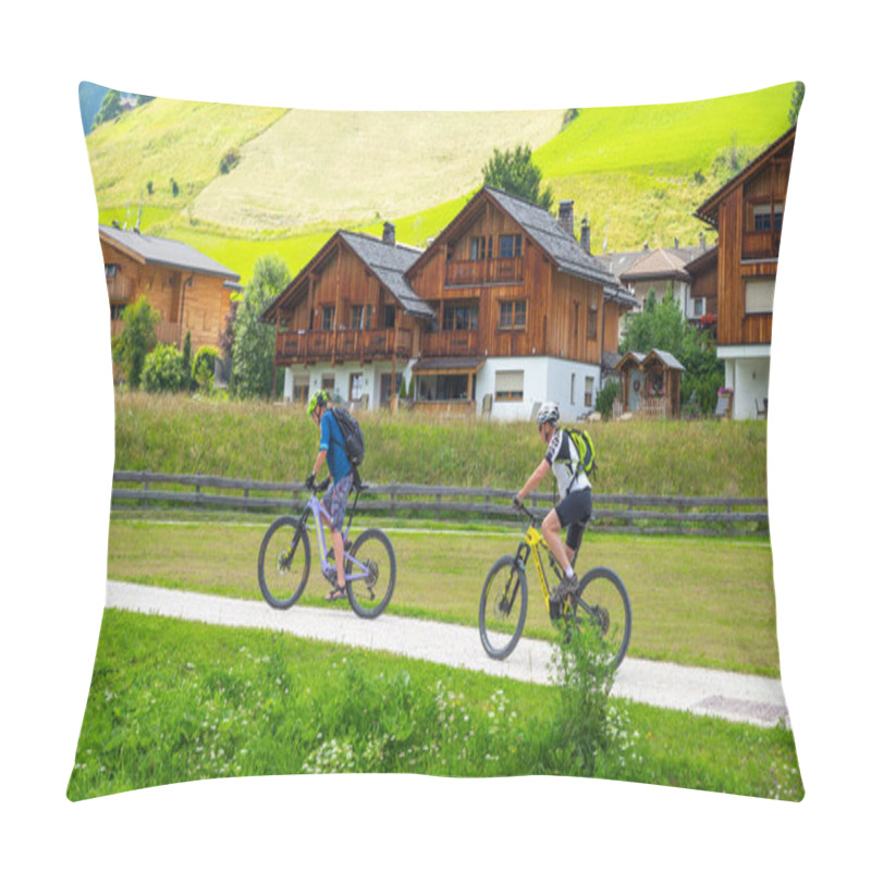 Personality  Dolomites, Italy---July 27, 2024: Two Young Men Biking Through The Beautiful Village At Corvara In Summer Pillow Covers