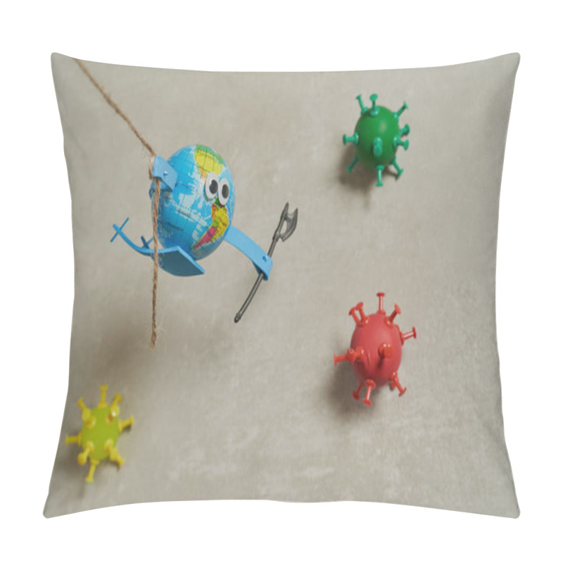 Personality  Conceptual Photo Of An Earth Toy Jumping With A String To Fight Against Three Viruses With An Ax In The Left Hand On A Grey Background. Pillow Covers