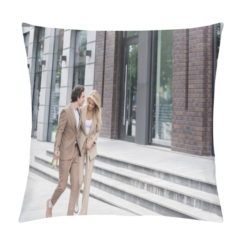 Personality  Full Length Of Smiling Couple In Stylish Suits Walking With Champagne Bottle Near Building Pillow Covers