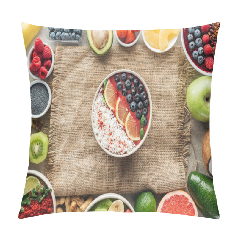 Personality  top view of smoothie bowls and frame made of fresh ingredients on sackcloth pillow covers