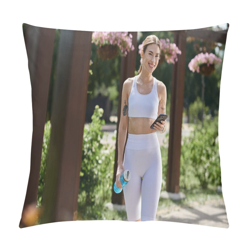 Personality  A Young Woman In White Activewear Walks Through A Park, Smiling And Holding A Water Bottle And Her Phone. Pillow Covers