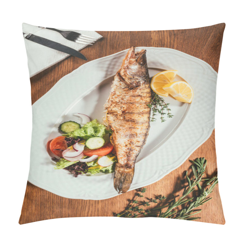 Personality  Fried Fish Laying On White Plate With Vegetables And Orange Slices Over Wooden Surface With Fork And Knife On Napkin Pillow Covers