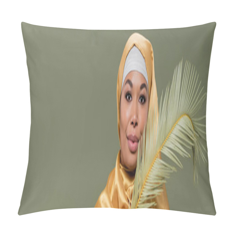 Personality  Young Multiracial Woman In Yellow Silk Hijab Smiling At Camera Near Leaf Of Tropical Plant Isolated On Green, Banner Pillow Covers