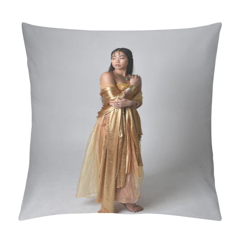 Personality  Full Length Portrait Of Pretty Young Asian Woman Wearing Golden Arabian Robes Like A Genie, Standing Pose Holding Flowing Fabric, Isolated On Studio Background. Pillow Covers