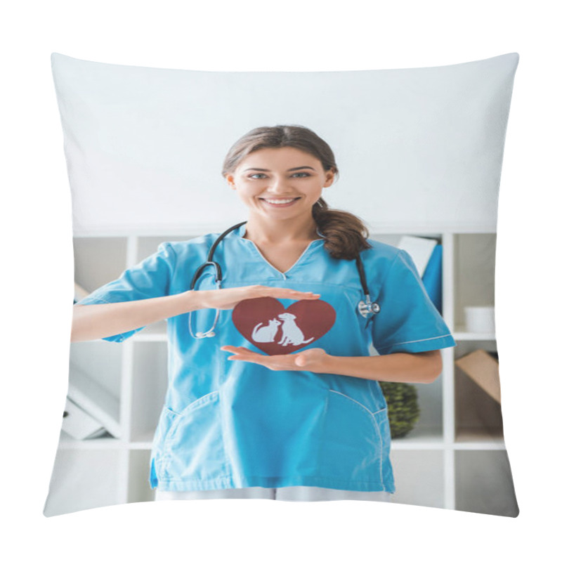 Personality  Attractive, Positive Veterinarian Smiling At Camera While Presenting Paper Cut Heart With Dog And Cat Symbols Pillow Covers