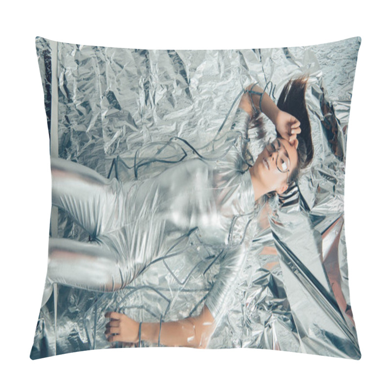 Personality  Top View Of Stylish Woman Posing In Silver Bodysuit And Raincoat On Metallic Background Pillow Covers