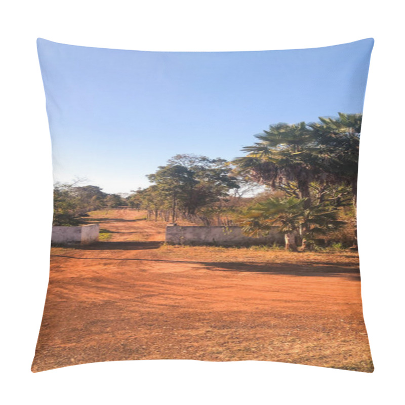 Personality  A Stunning Sunset Paints The Sky In Vivid Orange Tones, Reflecting On The Gentle Waves And Sandy Shore. Two Silhouetted Figures Walk Along The Water's Edge, With A Majestic Cliff Standing Tall In The Background. Pillow Covers