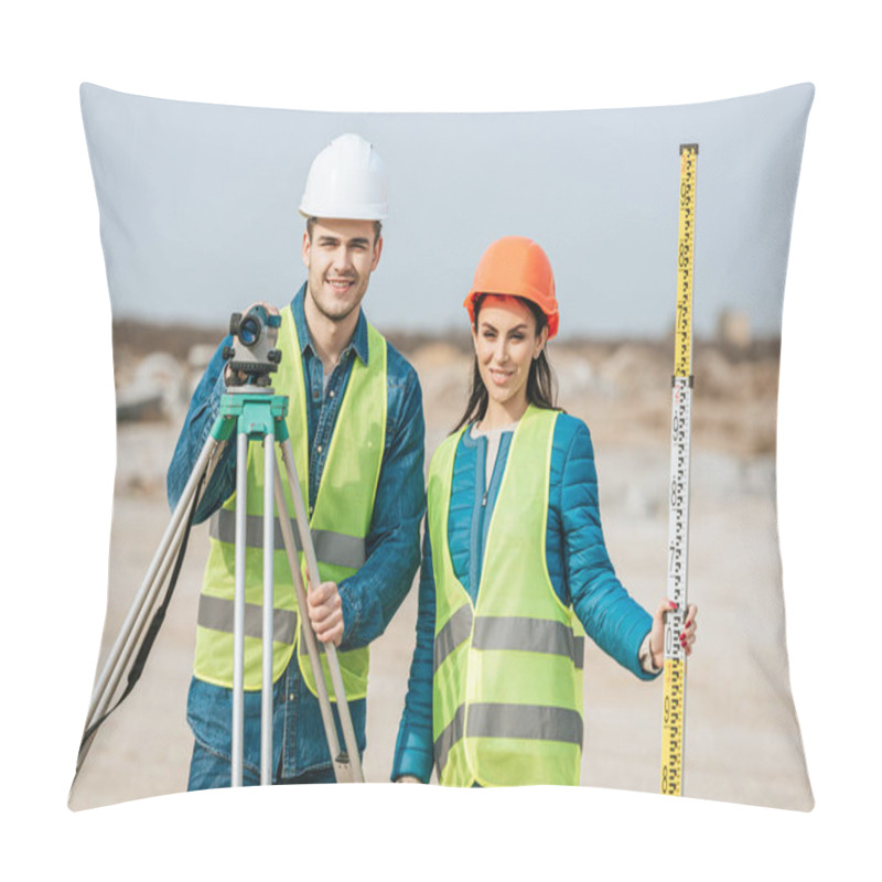 Personality  Smiling Surveyors With Ruler And Digital Level Looking At Camera Pillow Covers