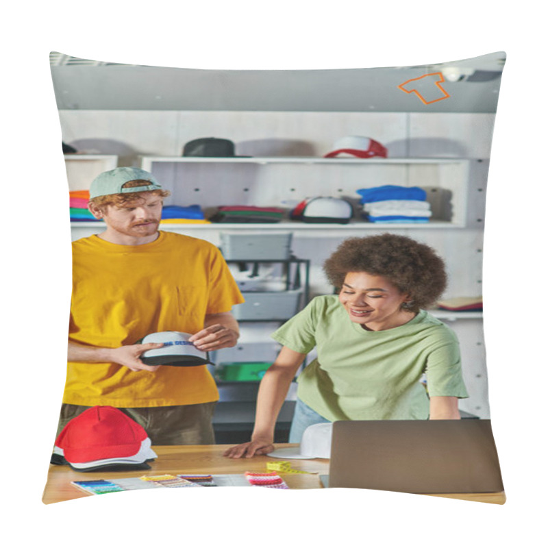 Personality  Smiling Young African American Craftswoman Using Laptop And Working With Cloth Samples Near Colleague With Snapback In Print Studio At Background, Sustainable Business Model Concept Pillow Covers