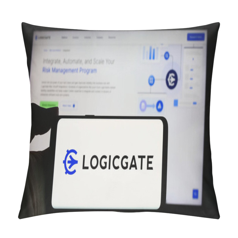 Personality  Stuttgart, Germany - 04-05-2024: Person Holding Cellphone With Logo Of US Risk Management Technology Compnay LogicGate Inc. In Front Of Business Webpage. Focus On Phone Display. Pillow Covers