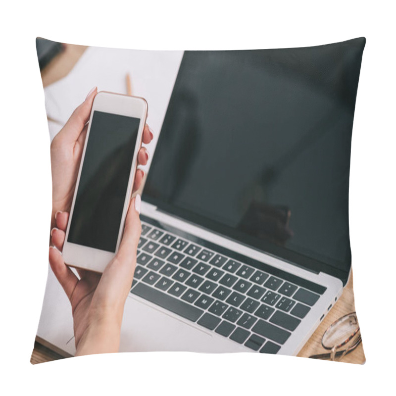 Personality  Cropped Shot Of Businesswoman Holding Smartphone With Blank Screen At Workplace With Laptop Pillow Covers