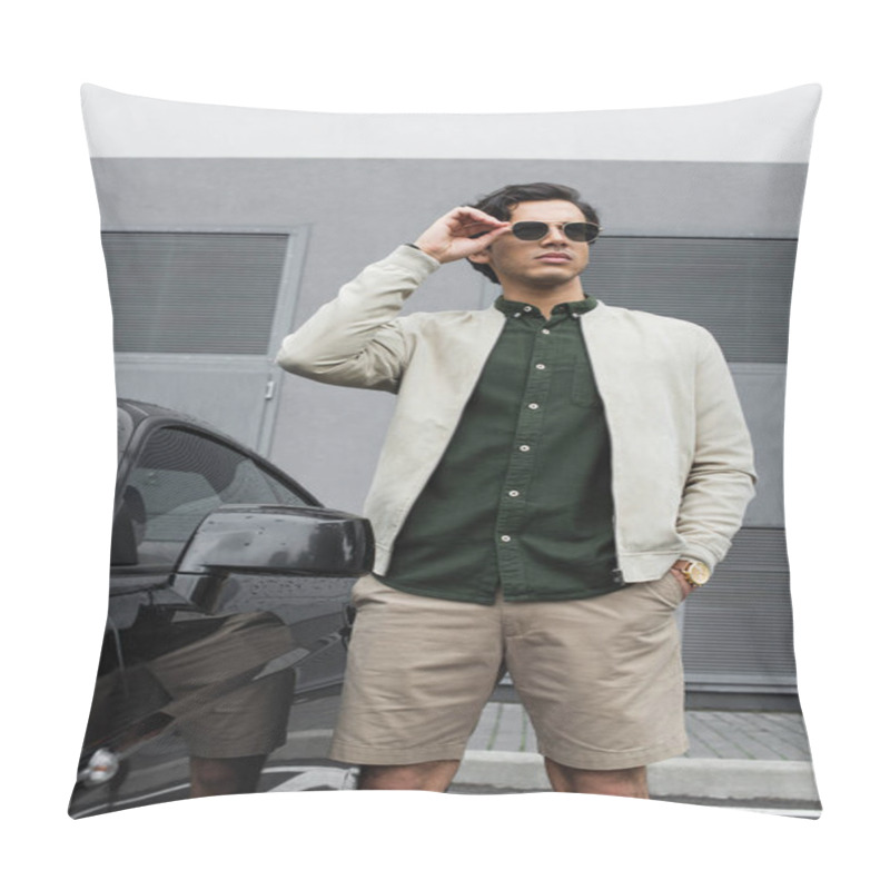 Personality  Young Man In Stylish Sunglasses And Bomber Jacket Standing With Hand In Pocket Near Modern Car Outside Pillow Covers