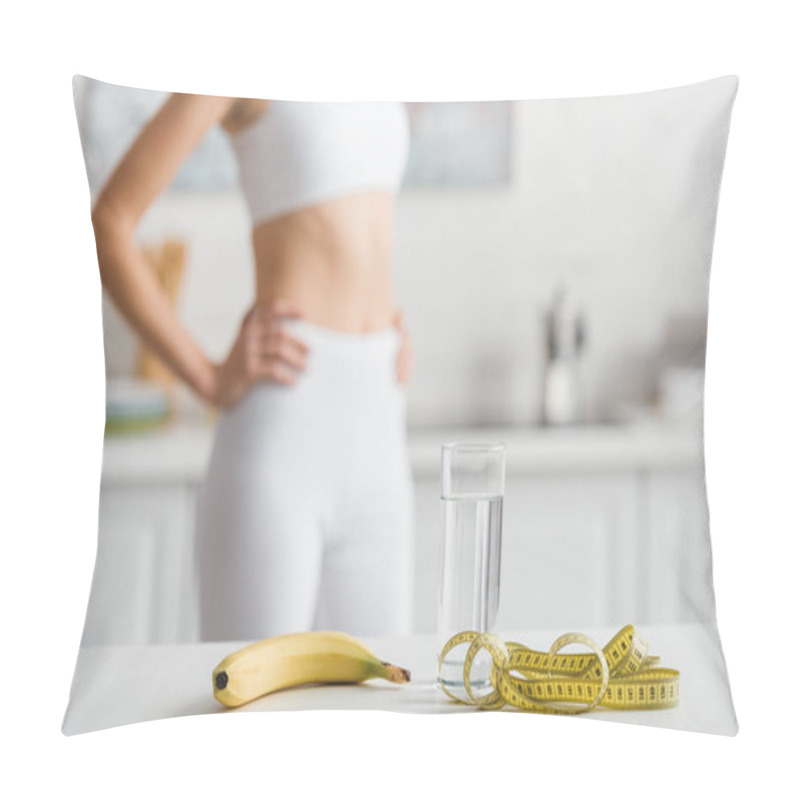 Personality  Selective Focus Of Banana, Glass Of Water And Measuring Tape On Table Near Sportswoman In Kitchen  Pillow Covers