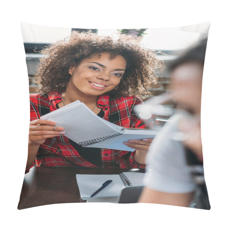 Personality  Young Smiling African American Woman Holding Notebook While Sitting At Table Pillow Covers