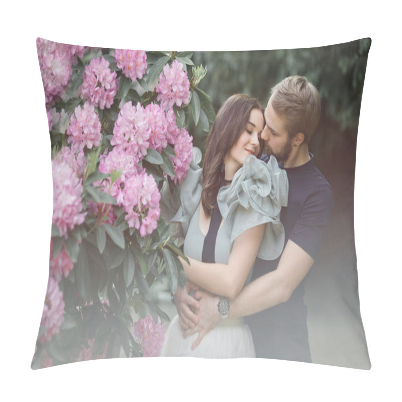 Personality  Love Story Of A Young Couple. Man And A Woman Hugging Each Other , Standing In A Rhododendrons Park In England Behind Pink Blooming Bush, Tree. Woman Is Wearing Fancy Light Green Top And Cream Tutu Skirt. Man In Blue T-shirt. Looking At Each Other Pillow Covers