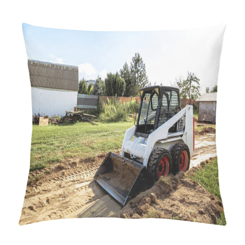 Personality  A Skid Steer Loader Clears The Site For Construction. Land Work By The Territory Improvement. Machine For Work In Confined Areas. Small Tractor With A Bucket For Moving Soil, Turf And Bulk Materials. Pillow Covers