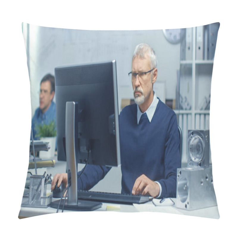 Personality  Busy Engineer Bureau. Chief Engineer Working At His Computer, Some Technical Components Lying On His Desk. His Assistant Works At His Desk In The Background. Pillow Covers