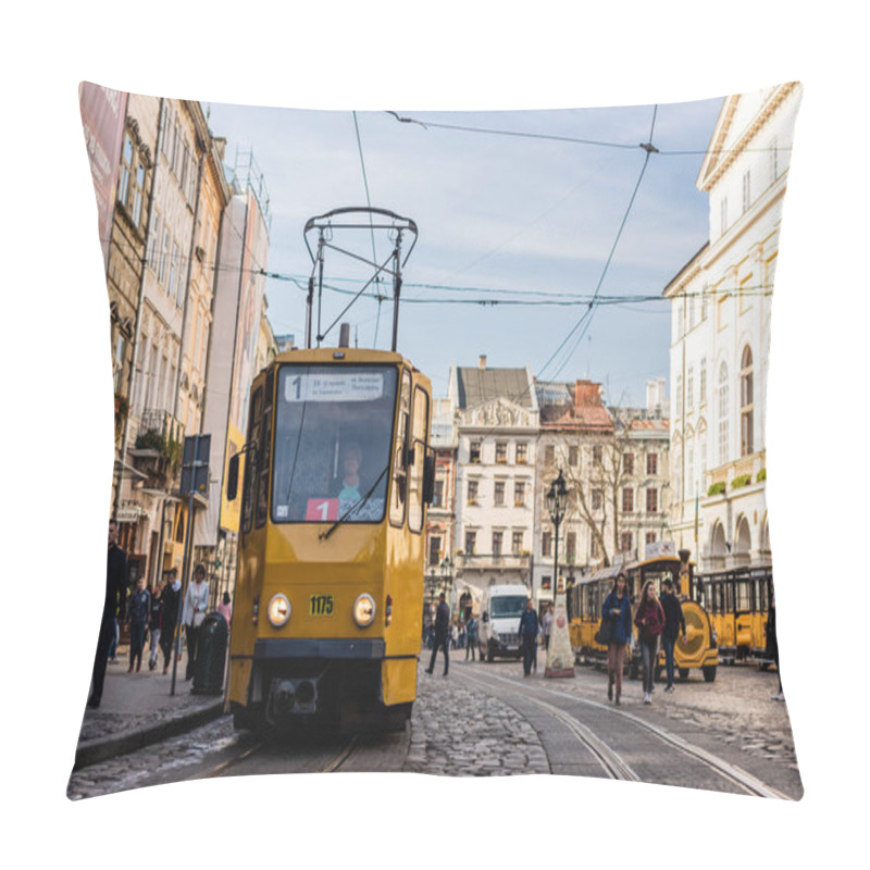 Personality  LVIV, UKRAINE - OCTOBER 23, 2019: Tram With Route Number One Lettering And People Walking Along Street In City Center Pillow Covers