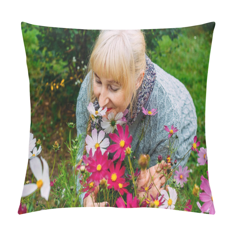 Personality  Attractive Blonde Woman Pensioner In A Gray Cardigan Sniffs Blooming Cosmos In The Summer In The Garden Pillow Covers