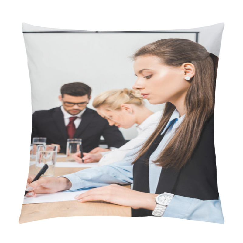 Personality  Attractive Young Businesswoman Writing On Blank Paper During Conference With Colleagues Pillow Covers