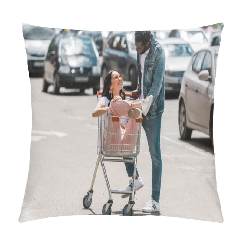 Personality  Happy African American Man Standing Near Asian Girl Sitting In Shopping Cart In Parking  Pillow Covers